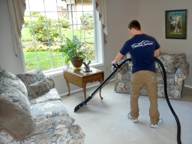 Cleaning a carpet in a Seattle home by Chinook Services a local provider.