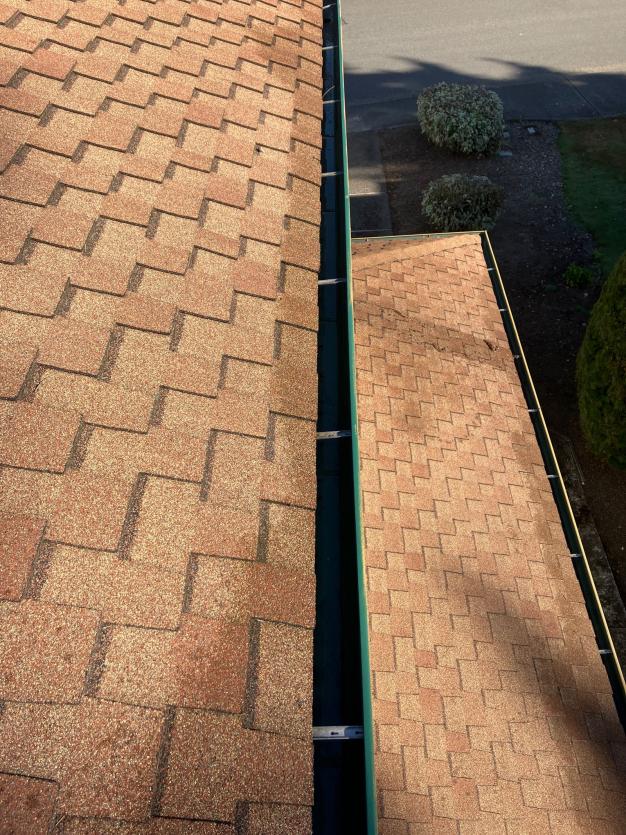 A Seattle homes gutter is clean after Chinook Services provided service of gutter cleaning