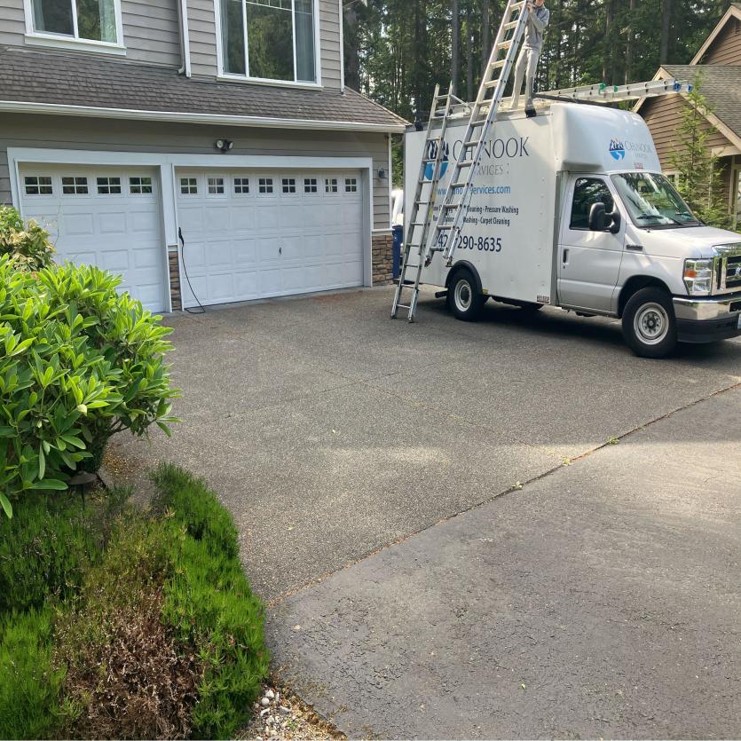 Window cleaning crew and truck Inglewood local home.
