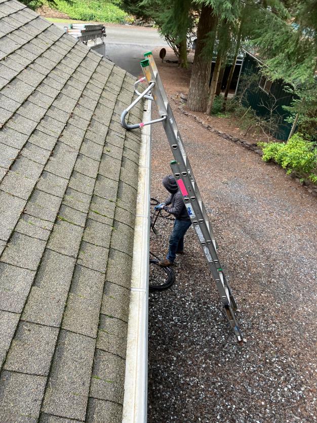 Gutter cleaning by hand in Issaquah, WA Chinook Services a local company.