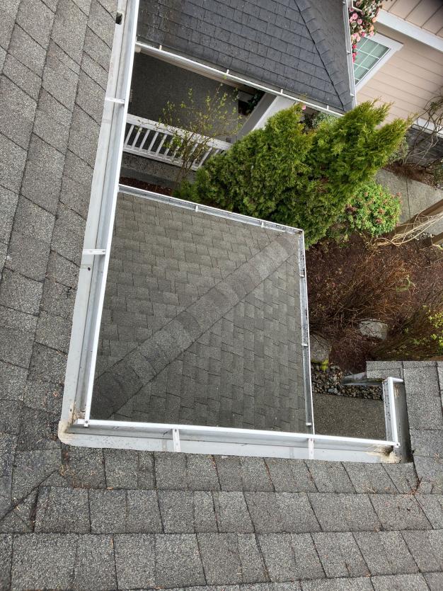 Chinook Services providing gutter cleaning on Juanita local home