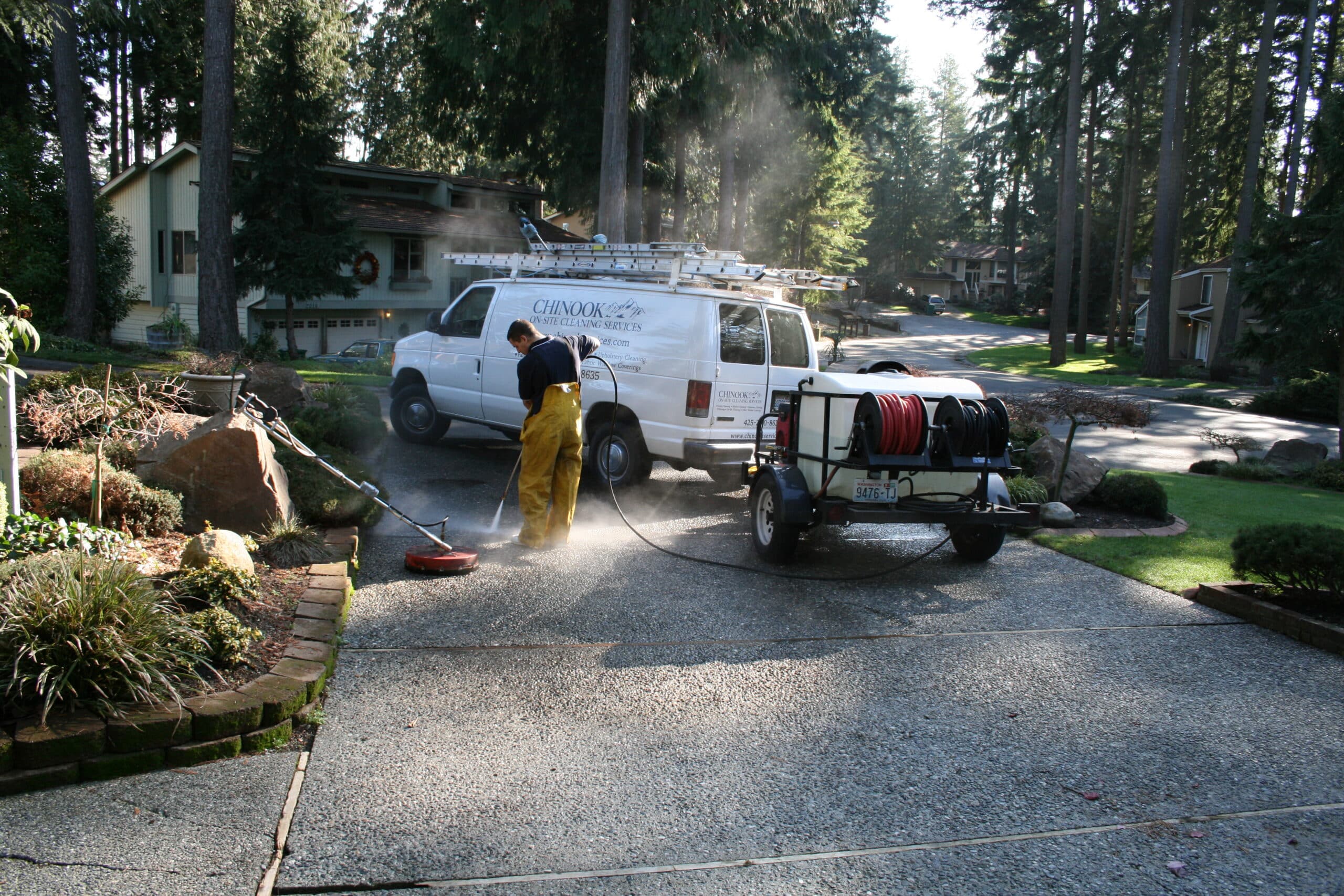 Pressure washing aggregate concrete driveway in Kenmore, WA