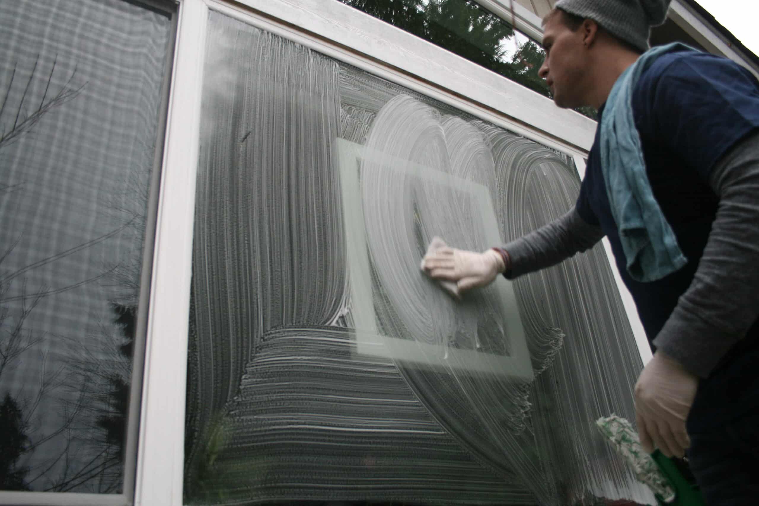 Detail cleaning a window in Mountlake Terrace, WA