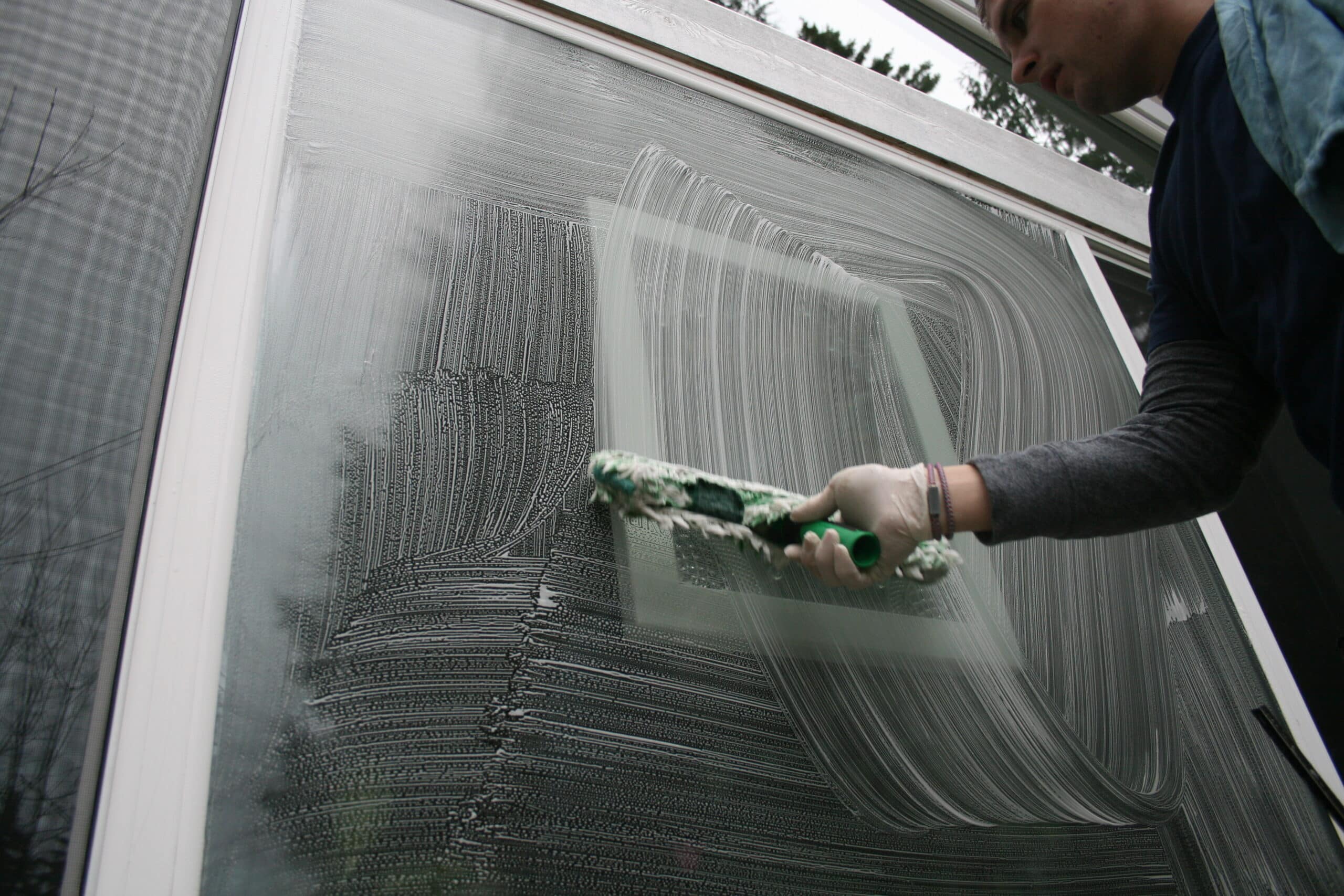Hand cleaning Mukilteo window by Chinook Services