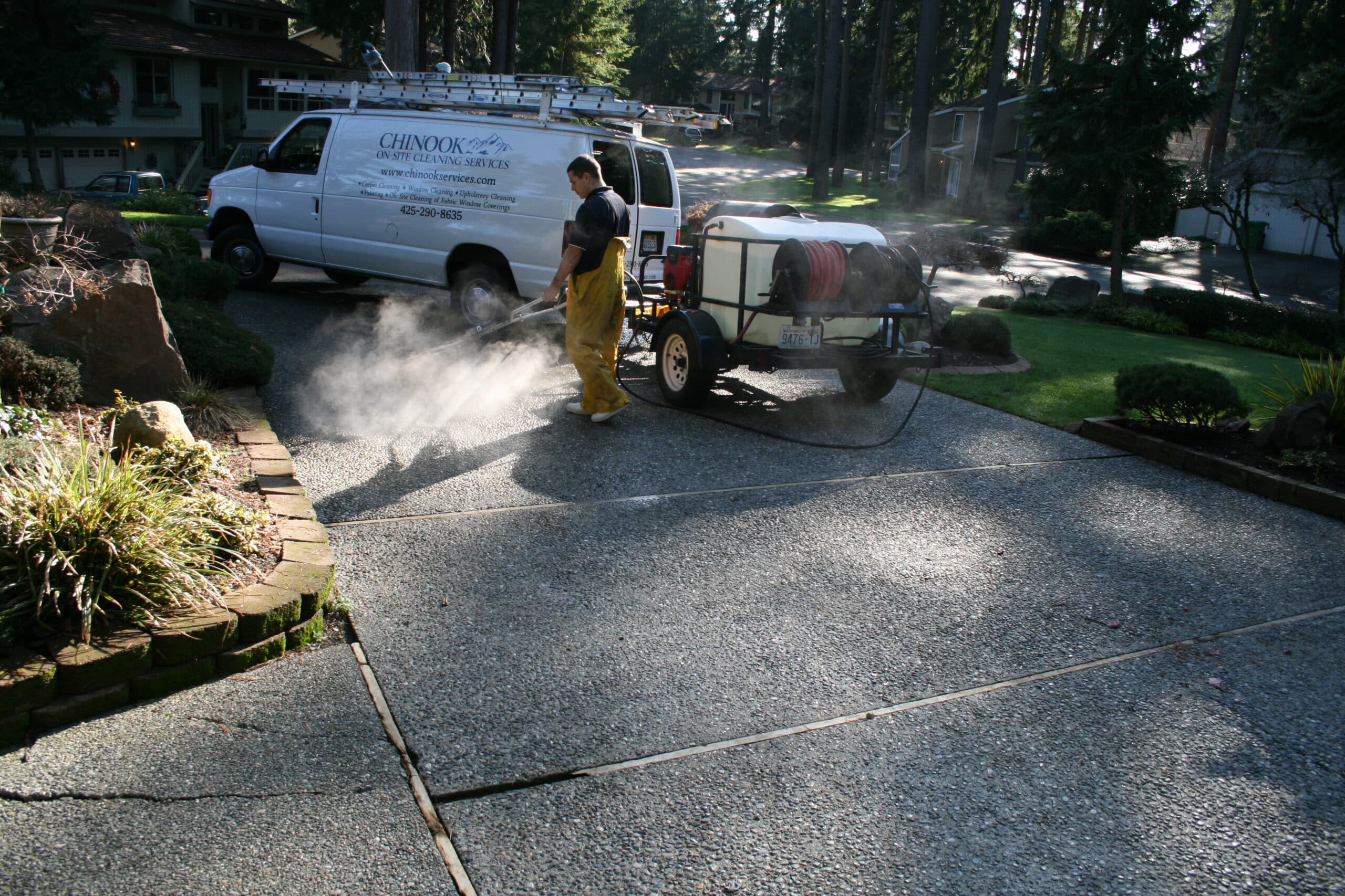 Pressure washing concrete driveway in Overlake neighborhood