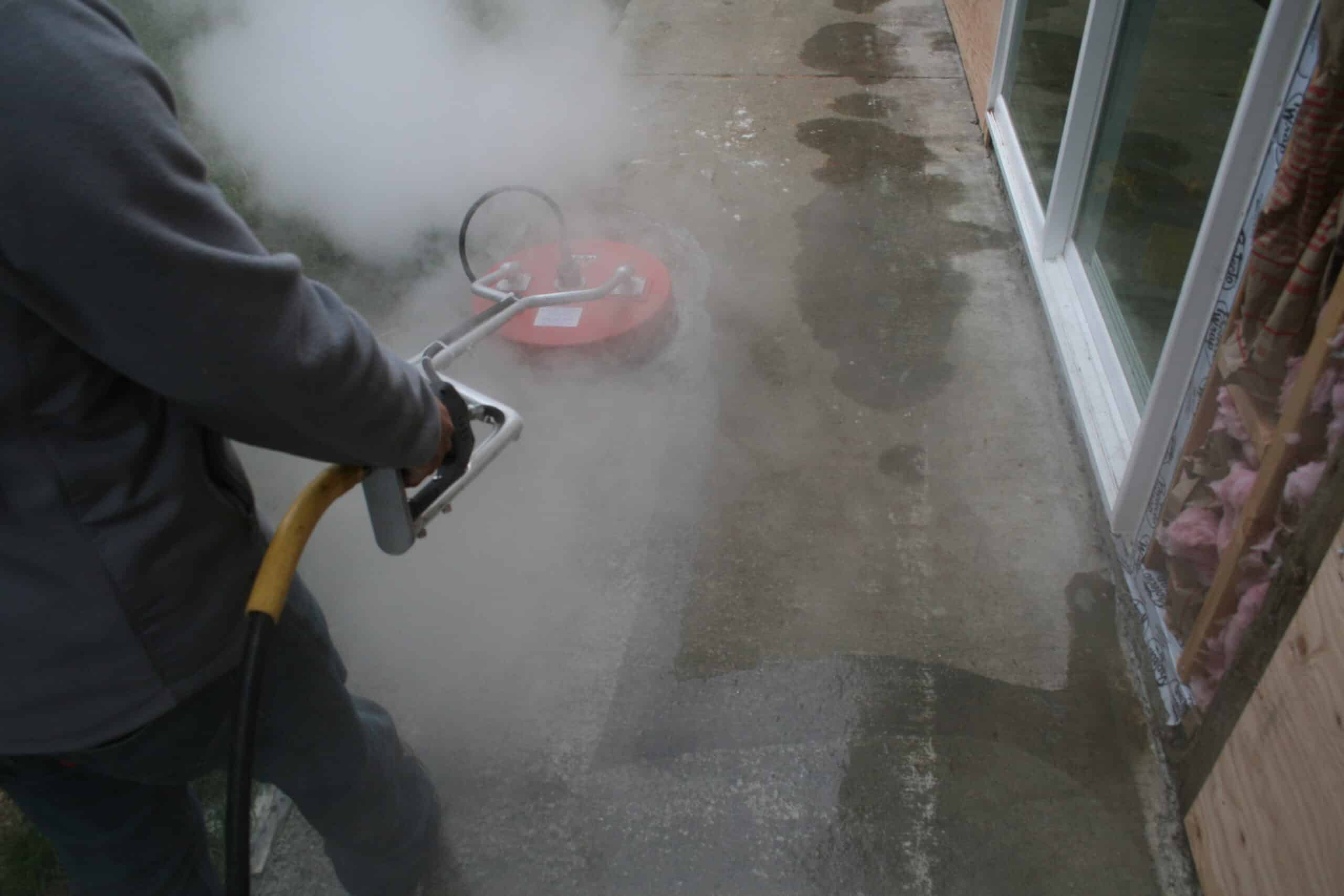 Using surface cleaner to pressure wash driveway in Paine Field