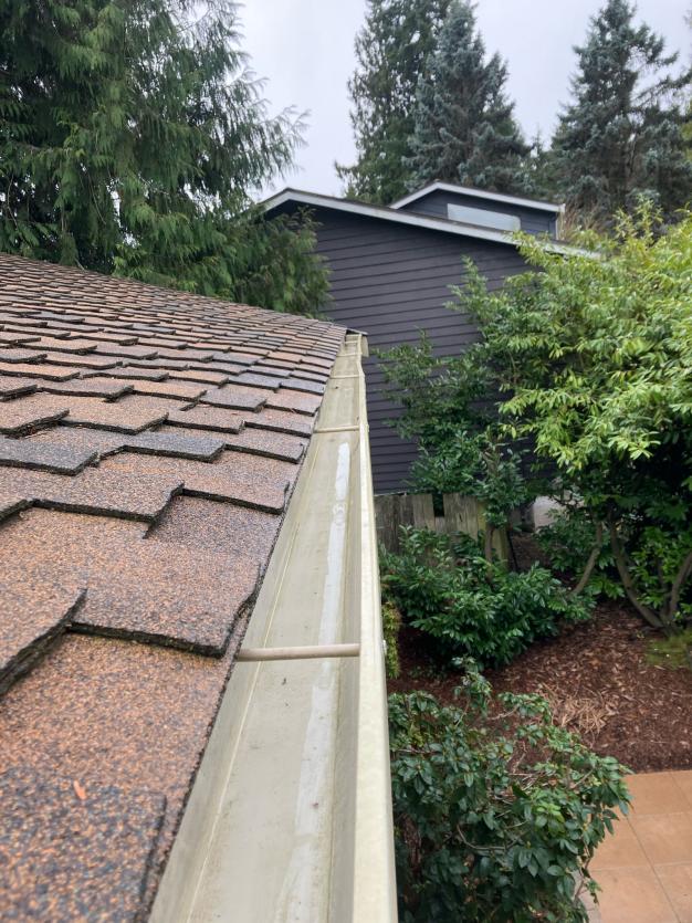 Gutter cleaning service Sahalee, WA after hand cleaned and flushed to remove clogs