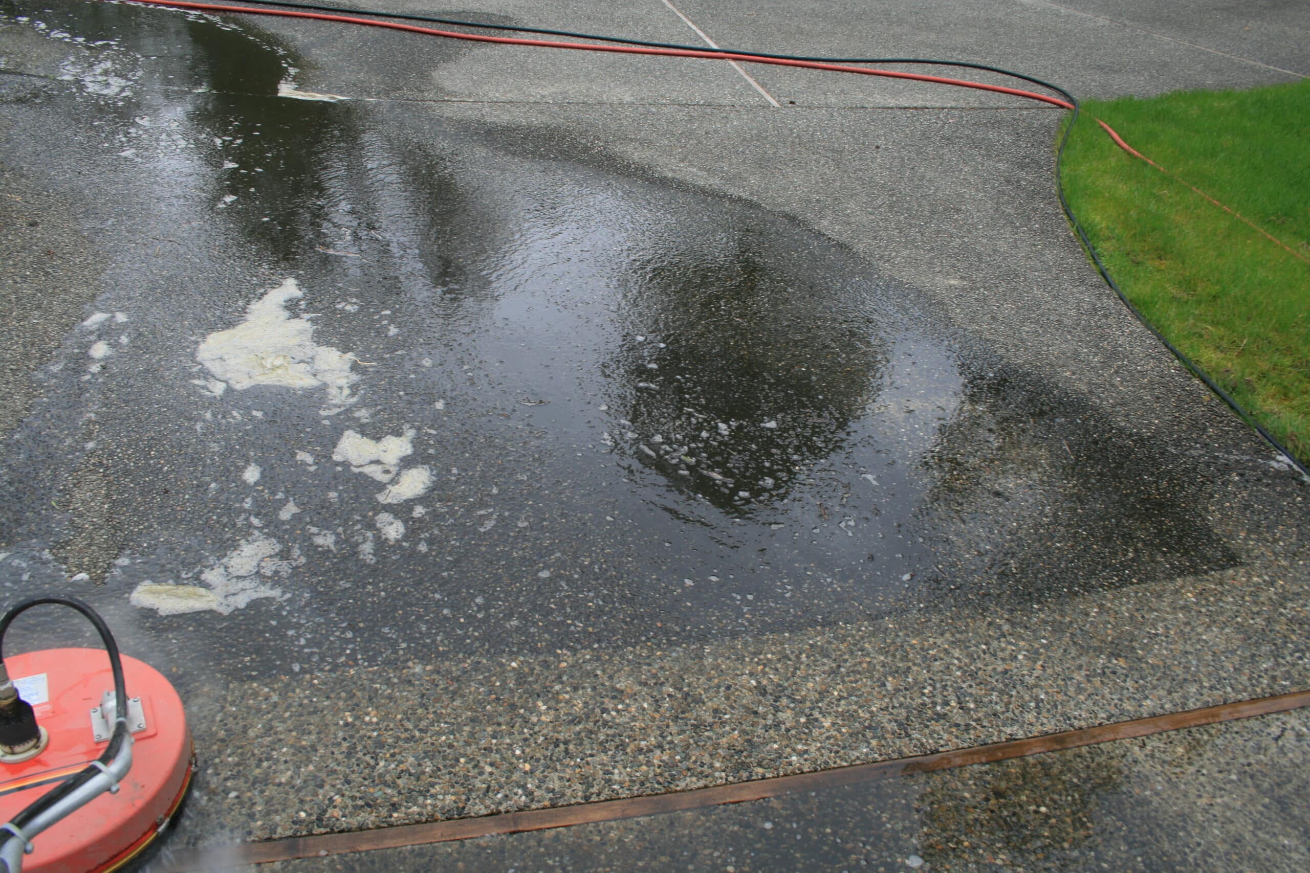 Pressure washing Woodridge neighborhood driveway
