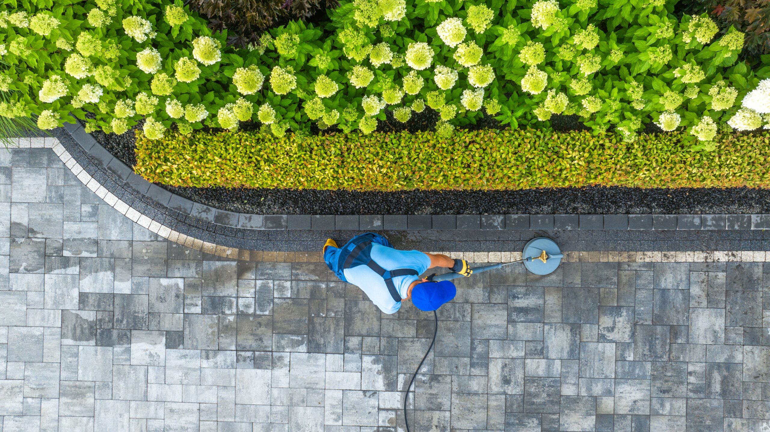 Pressure washing driveway in Seward Park