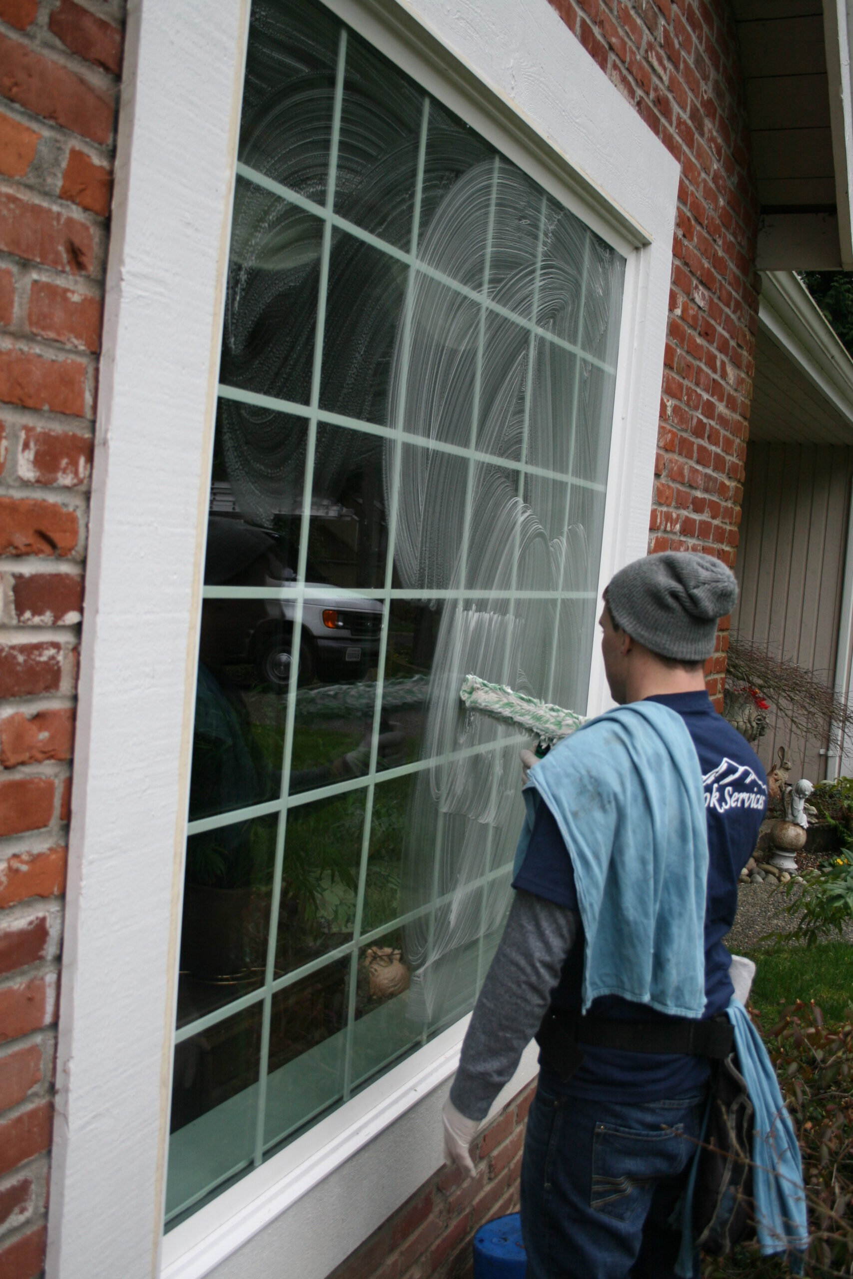 Cleaning large window in View Ridge neighborhood Seattle, WA